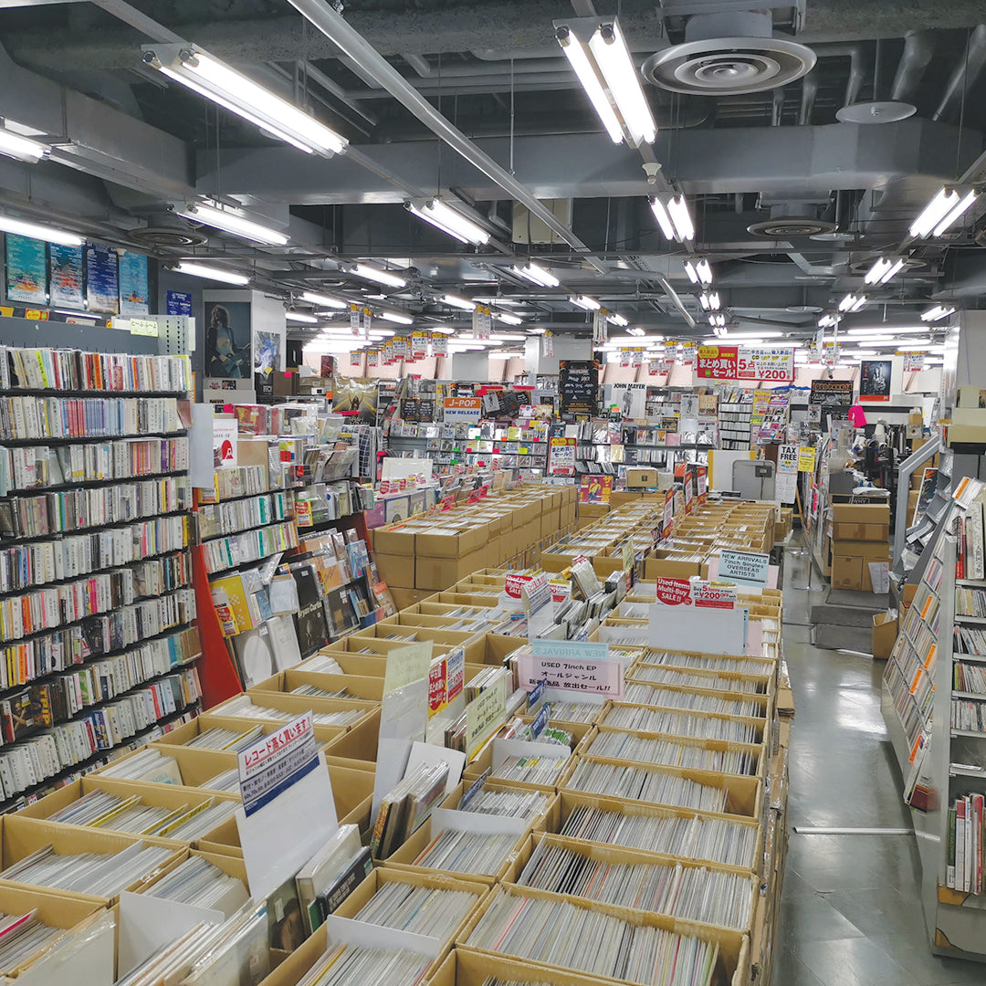 Large record and music store with rows of browsing shelves