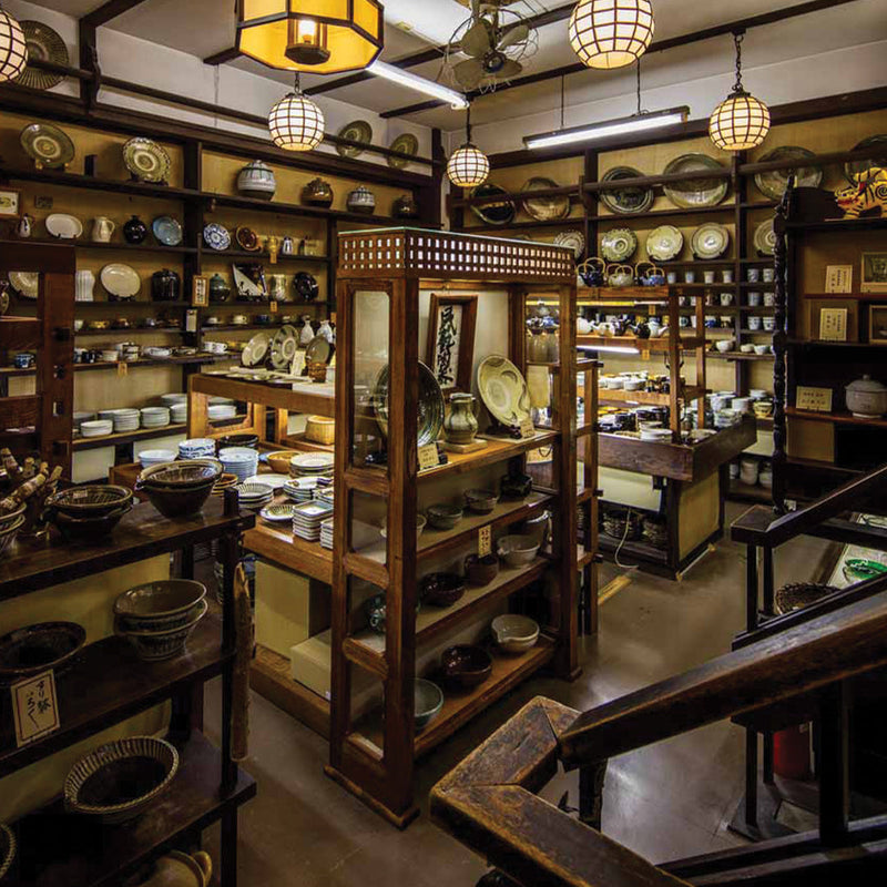 Shelves of Japanese ceramic bowls, cups, and serving pieces