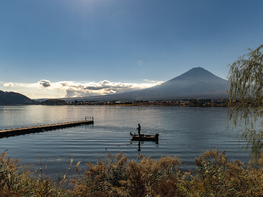 Mount Fuji reflected across Lake Kawaguchi at dusk