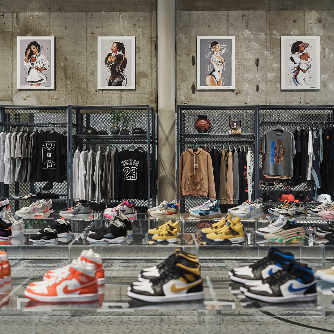 Sneakers and folded streetwear displayed in a Tokyo shop