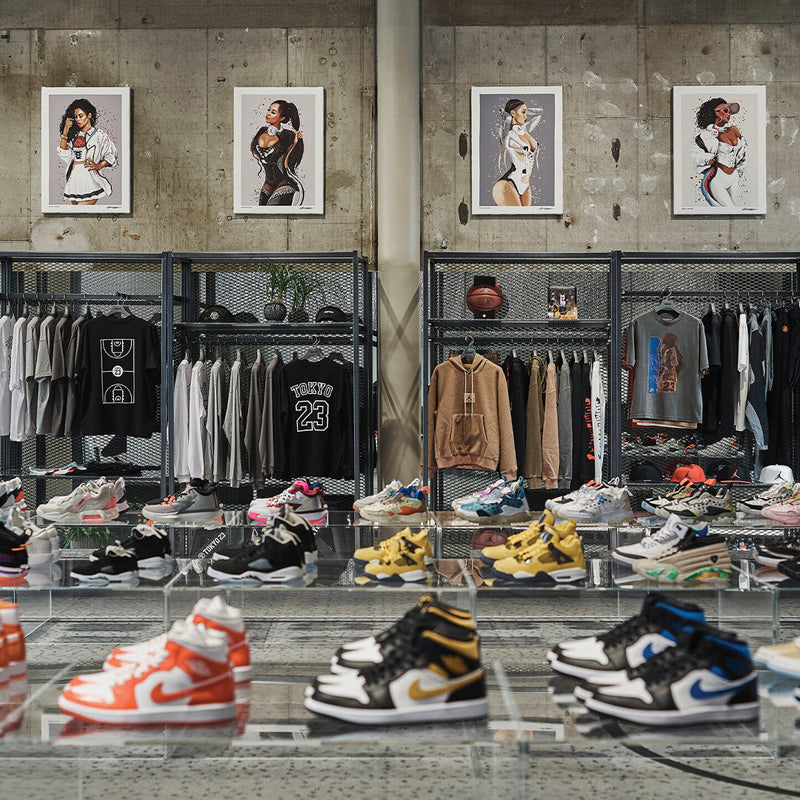 Sneakers and folded streetwear displayed in a Tokyo shop