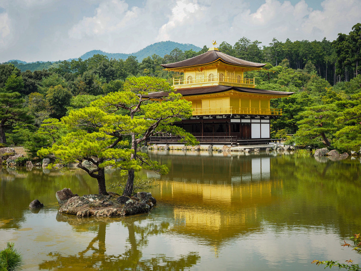 Kinkaku-ji, the gold-leafed pavilion in Kyoto, reflected in its pond.