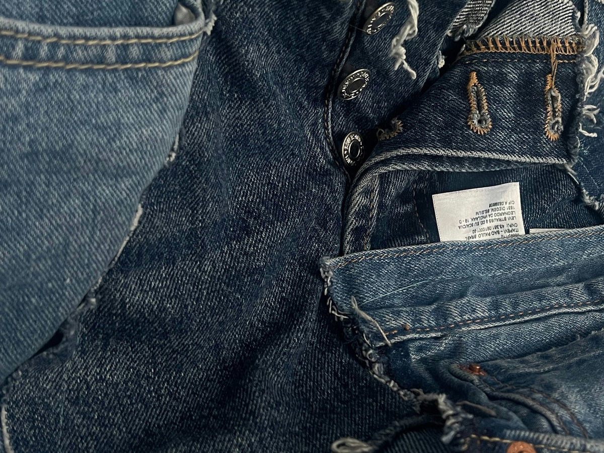 Indigo denim pieces and raw selvedge edges in a workshop