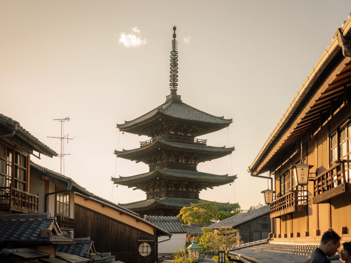 Traditional pagoda and wooden streets in Kyoto in warm evening light